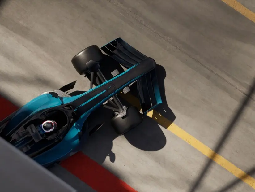 Pit alanı garajından çıkan modern bir genel spor yarış arabasının üstten yüksek açılı görüntüsü